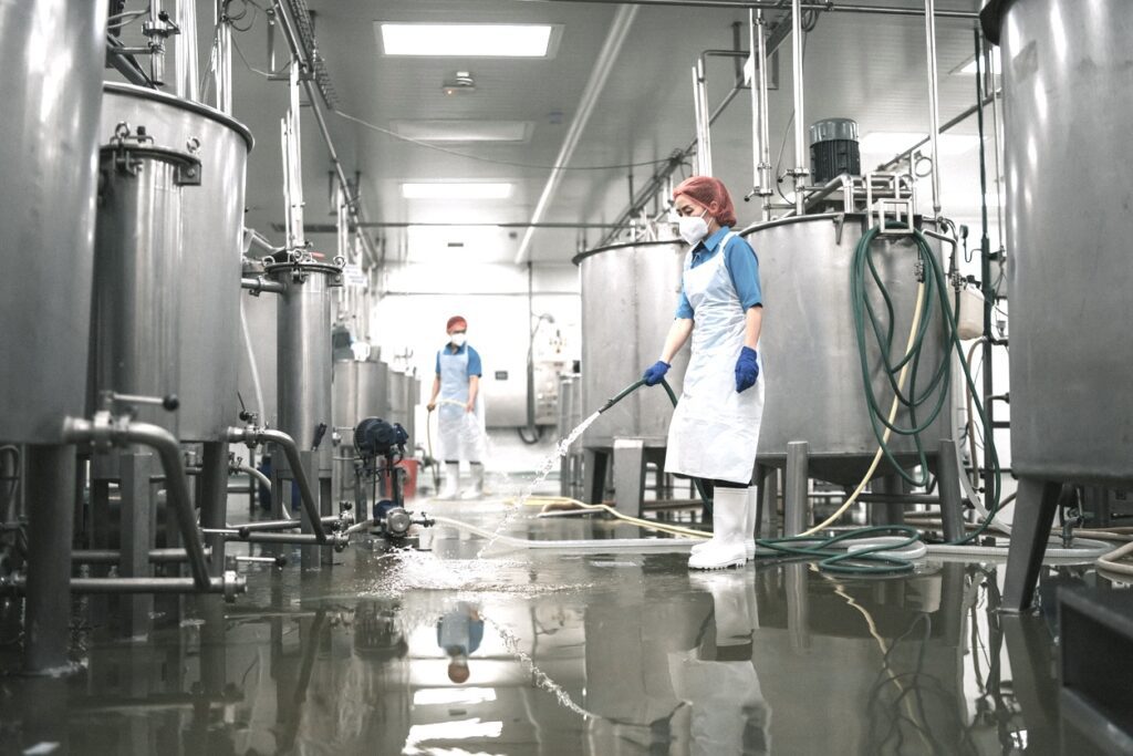 cleaning and maintaining your industrial floor drains, tips and tricks. Factory floor being cleaned.